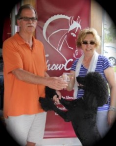 Photo   A toast to the season- Doug and Michele Hundt and their famous dressage greeter, Arlo toast the 2013 dressage season in Florida. (JRPR photo