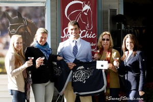 Shades of Grey and Blue Accent ShowChic   Best Turnout Awards at Dressage at Devon   Wellington, FL (October 2, 2013) - While Paris and London Fashion Weeks were touting the stylish return of the blues – from slate to ultramarine – Kimberly Herslow and Benjamin Albright were recognized by popular equestrian fashion boutique, ShowChic, and Italian equestrian fashion designer Equiline, for equally cool blue- and grey-toned turnouts for their horse jogs during Dressage at Devon, September 24-29, in Pennsylvania.