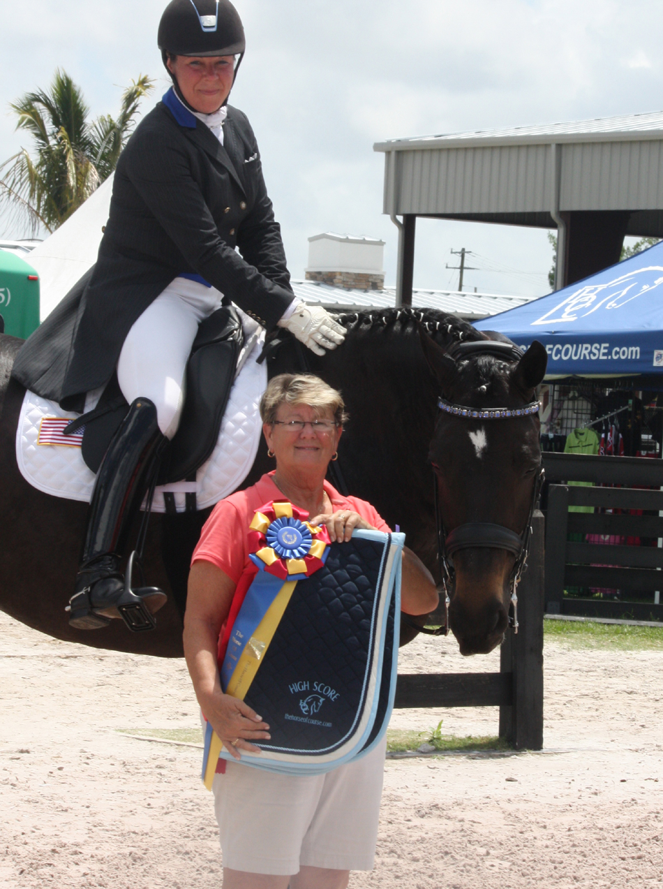 The Horse Of Course Supports Competitors During Global Dressage Festival Wellington, FL (December 30, 2013) - Three times is a charm for The Horse of Course, Inc., which will return for the third year to the 2014 Adequan Global Dressage Festival, January 8 – March 30 in Wellington to again sponsor The Horse of Course High Score Awards recognizing the highest-scoring rides of the GDF CDI series. The Horse of Course High Score Award winners will receive ribbons acknowledging their pinnacle achievement and embroidered saddle pads courtesy of The Horse of Course.