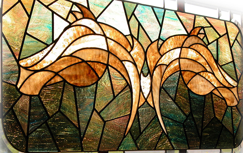 Stained Glass Equestrian Art by GlassWish, Inc. Doreen Mahlstedt lives in northern Indiana and has successfully combined her passions – horses, graphic arts and stained glass - into her business called GlassWish, Inc. "I strive to abstractly portray the beauty of the horse in glass by reducing the lines, muscles and impression of the horse to a few significant lines, accented by the glass texture and color. I have a few stained glass horse pieces in my home and every time I glance at them, I'm reminded of the precious gift God has given us in the form of the horse and I enjoy sharing this appreciation with other like-minded people. Doreen's work was recently featured by Kym Eitel, award winning Bush Poet, in her new book "For the Love of Horses".