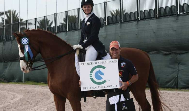Surgical Precision: Veterinarian and Choice of Champions Performance Award Winner Kristi Truebenbach Lund Wellington, FL (March 10, 2014) - Dressage isn't exactly as complicated as surgery, but that's why Adequan Global Dressage Festival amateur division rider, Boca Raton veterinarian and Choice of Champions Performance Award winner, Kristi Truebenbach Lund, loves it. Truebenbach Lund, riding Blue Marlin Farm's 13 year-old Hanoverian gelding, Reel Adventure (Rotspon x Lanthas), embodied the spirit of the COC Performance Award, which salutes outstanding riding across the divisions during this year's Adequan Global Dressage Festival, by turning in rock-solid scores in the sixties in her Adult Amateur FEI Prix St. Georges and FEI Intermediare I tests on Friday and Saturday.