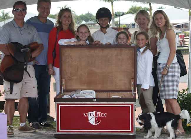 Two Winners Unlock Big Prizes from Vita Flex at the Adequan Global Dressage Festival and the FTI Winter Equestrian Festival Wellington, FL (April 8, 2014) – “When I put the key in and it opened, I got goose bumps. It was great,” dressage rider Paula Matute said about the key that matched the lock of a Vita Flex prize trunk at the Adequan Global Dressage Festival on March 14, 2014. Young rider Isabella Sica shared Matute’s excitement when she unlocked the prize trunk at the FTI Consulting Winter Equestrian Festival the next day. All riders who won a class at either the Adequan Global Dressage Festival or the Winter Equestrian Festival in Wellington, Florida were given a key along with their winning ribbon. Every rider hoped that their key would be the one to open the Vita Flex trunk filled with equestrian products.