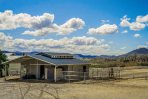 This 25+ acre ranch with equestrian facilities, 4045 Old US Highway 395, will sell at auction next month via Concierge Auctions in cooperation with listing agent Jean Merkelbach of Engel & Volkers Lake Tahoe. 